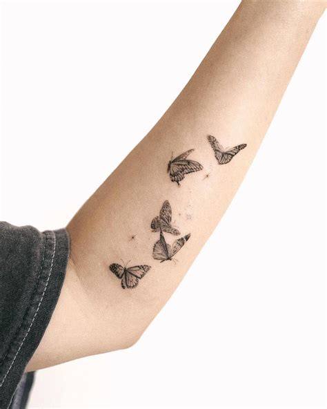 mariposas tatuaje brazo